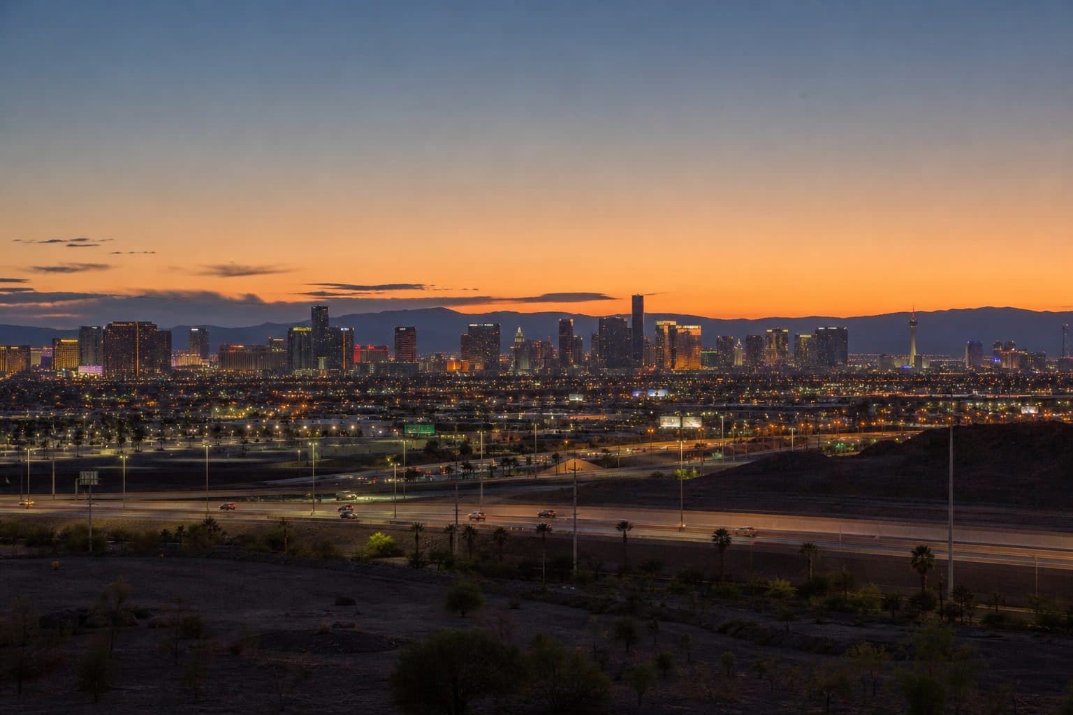 Las Vegas Strip skyline viewed from a southeast valley overpass at dusk