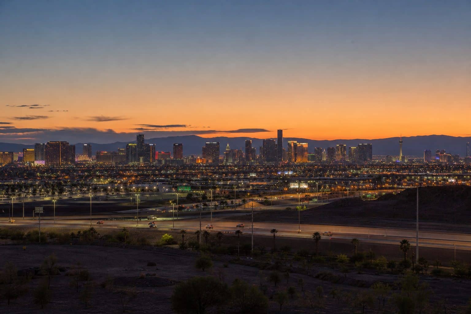 Las Vegas Strip skyline viewed from a southeast valley overpass at dusk