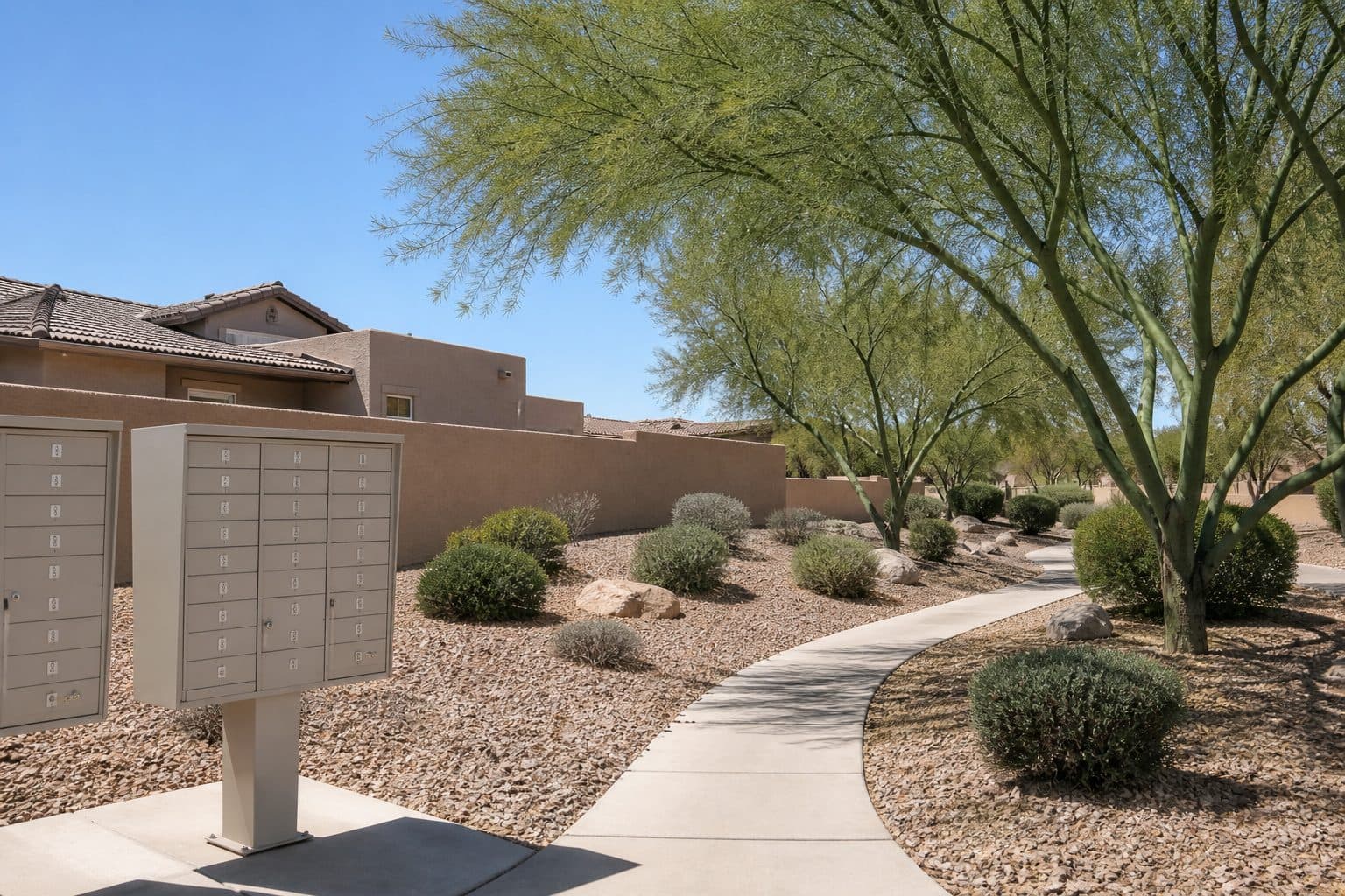 HOA-maintained desert landscaping and sidewalks in Manzano Peak